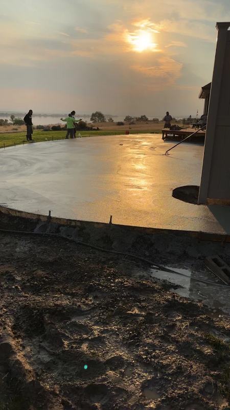Freshly finished stamped concrete patio reflecting golden evening light